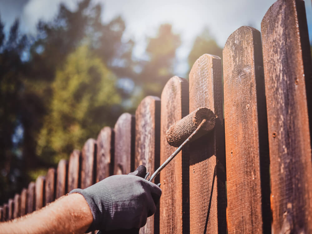 handyman painting a wooden fence - SMI Handyman Leeds, Horsforth