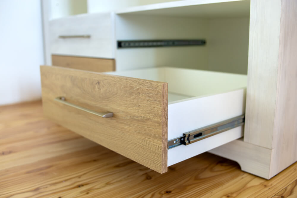 picture of a set of white draweres with the bottom drawer pulled out - SMI Handyman Leeds, Horsforth